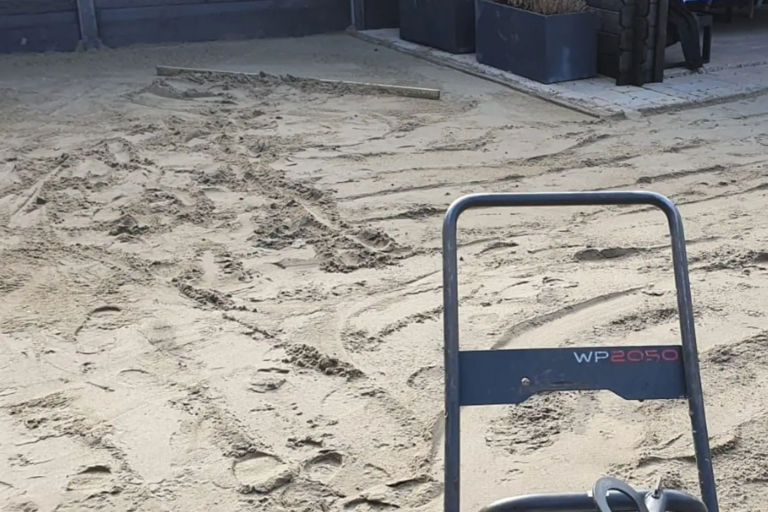 Zand onder kunstgras